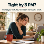 Woman at her desk rubbing a tight shoulder in the afternoon