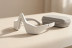 Close-up side view of the eye massager showing soft padded fit