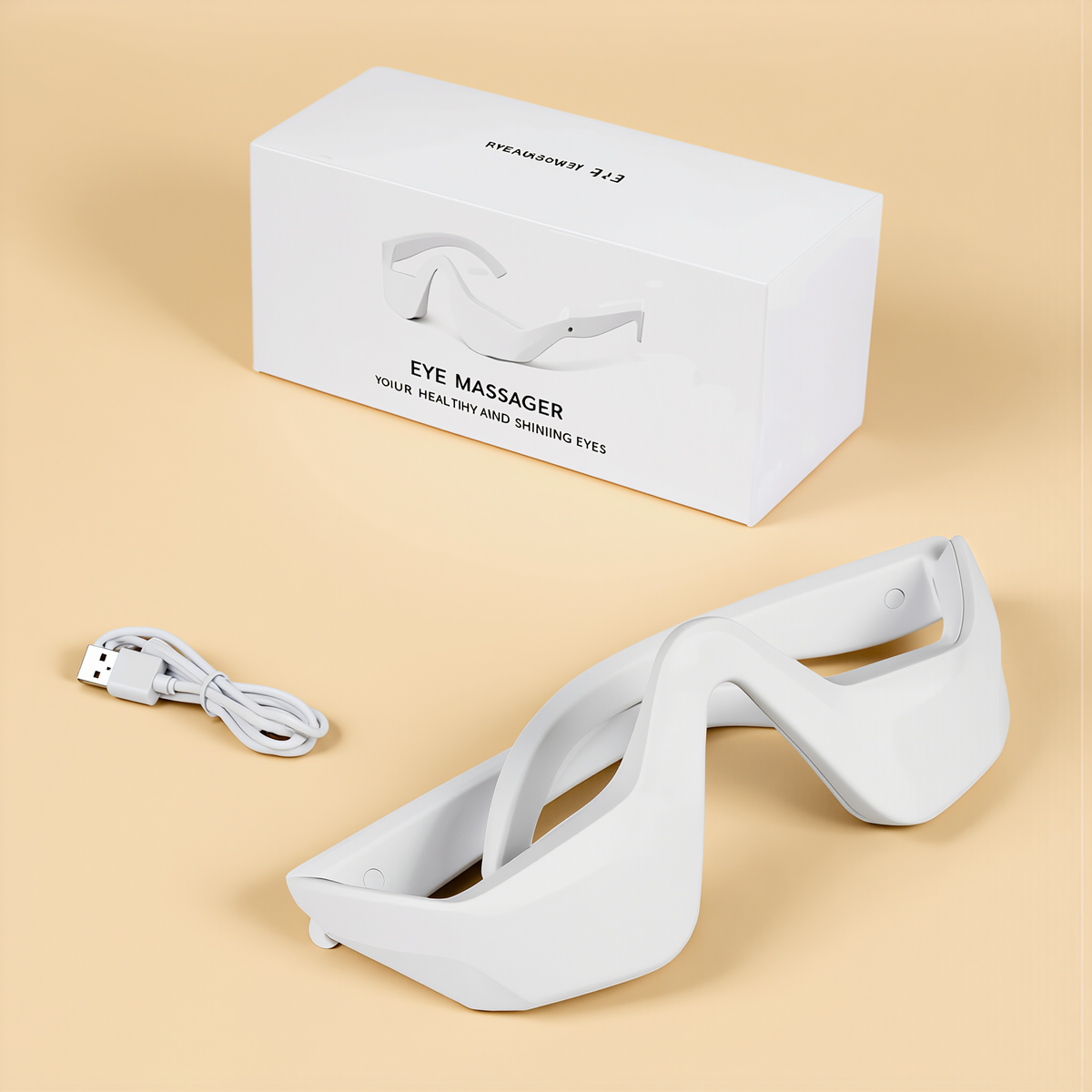 Flat lay of the eye massager with USB-C charging cable