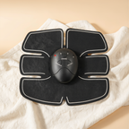 Black abdominal muscle stimulator toner, single product studio shot